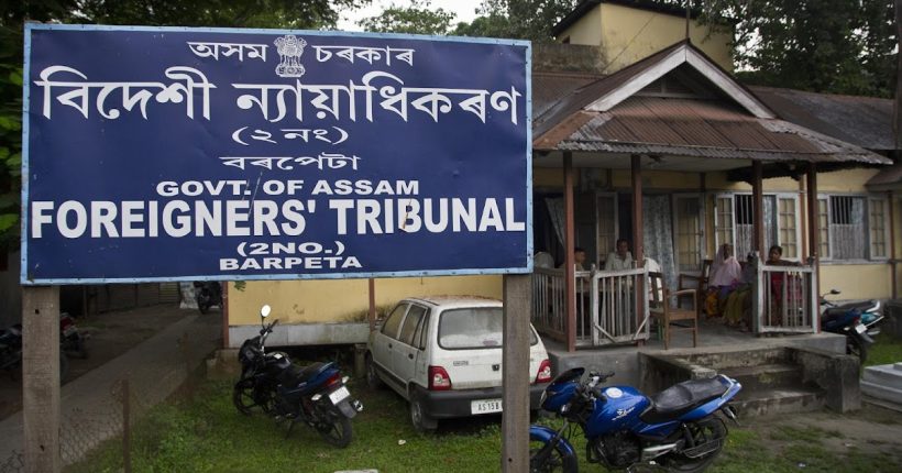 In this Aug. 28, 2019, photo, people wait at the Foreigner's Tribunal office in Barpeta, in the northeastern Indian state of Assam. India plans to publish a citizenship list in the northeastern state of Assam on Saturday, Aug. 31, that advocates hope will help rectify decades of illegal immigration from Bangladesh. Critics of the list worry it will leave millions of people stateless, leading to detention or deportation. Some cases have even led to suicide. (AP Photo/Anupam Nath)